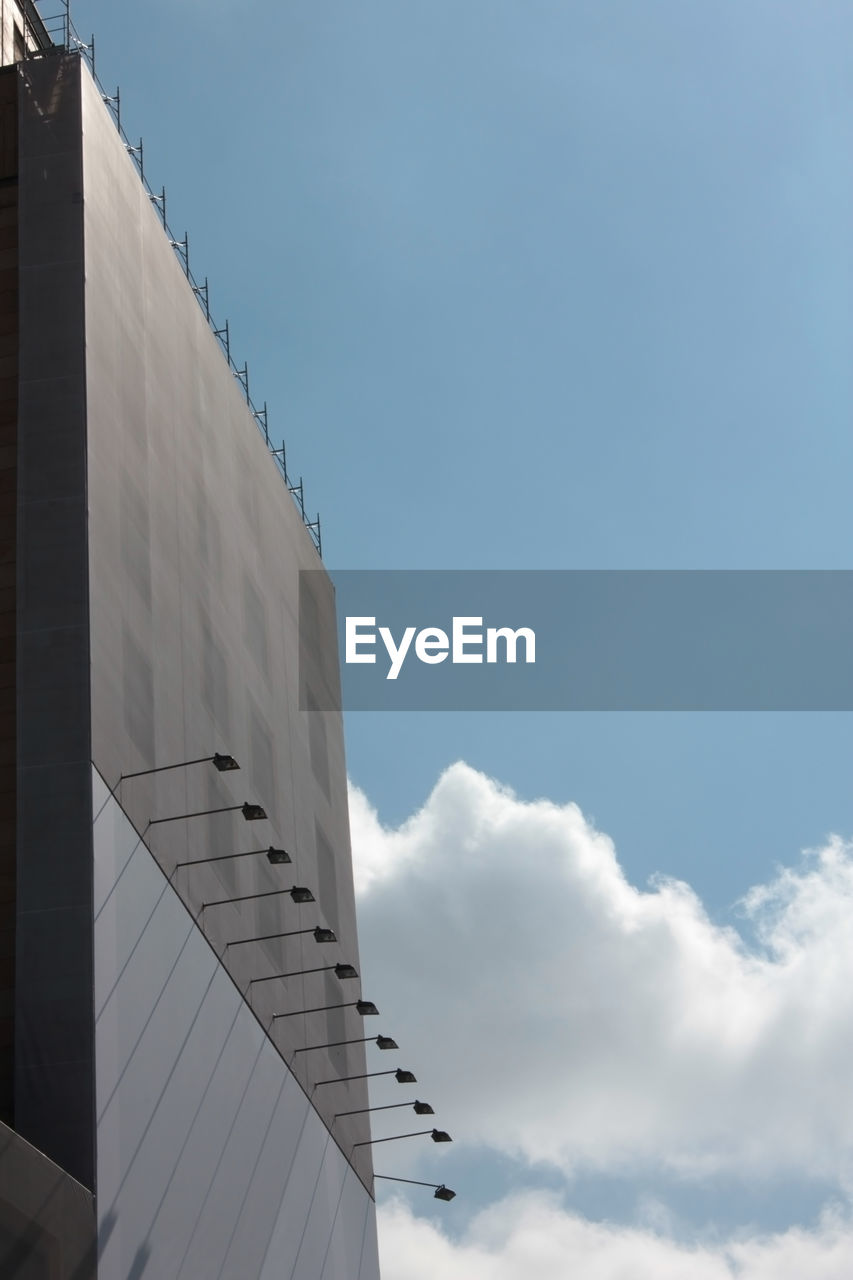 Low angle view of a building against sky with blank adv area and copy space