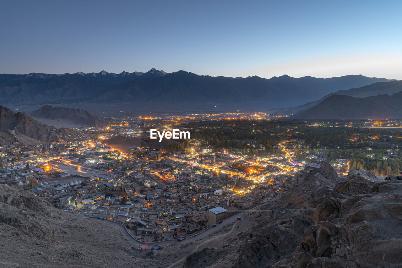 Leh sunset city view with snowcapped mountain range background