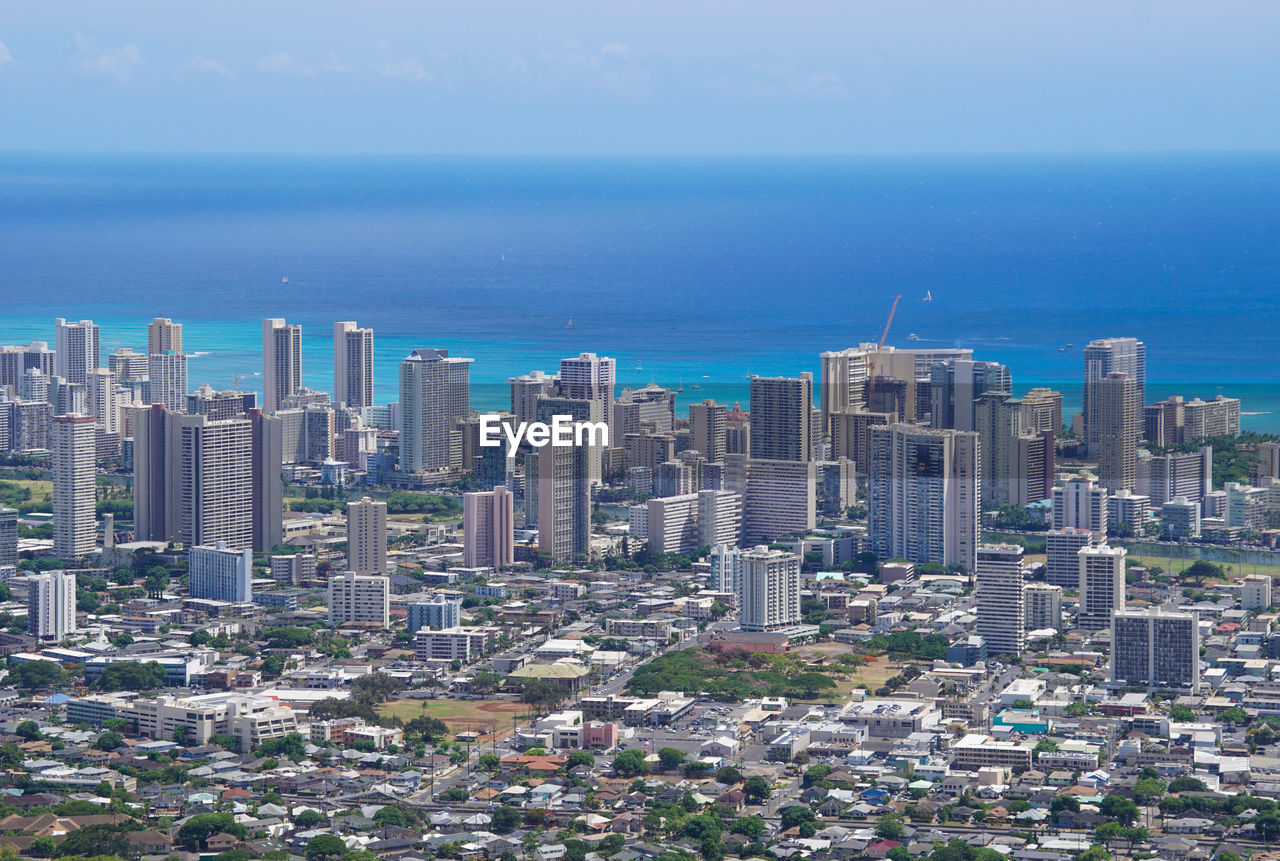 HIGH ANGLE VIEW OF BUILDINGS AGAINST SKY