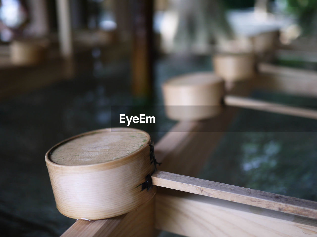 Close-up of bamboo dipper on shishi-odoshi fountain
