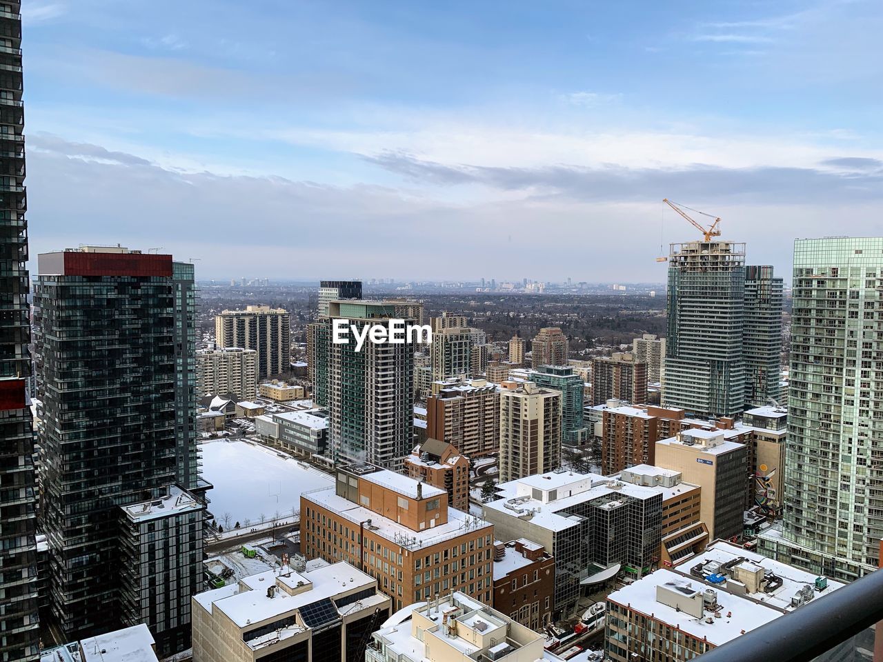 HIGH ANGLE VIEW OF BUILDINGS AGAINST SKY DURING WINTER