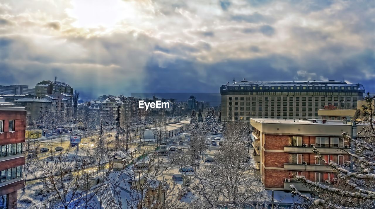 CLOUDY SKY OVER CITY