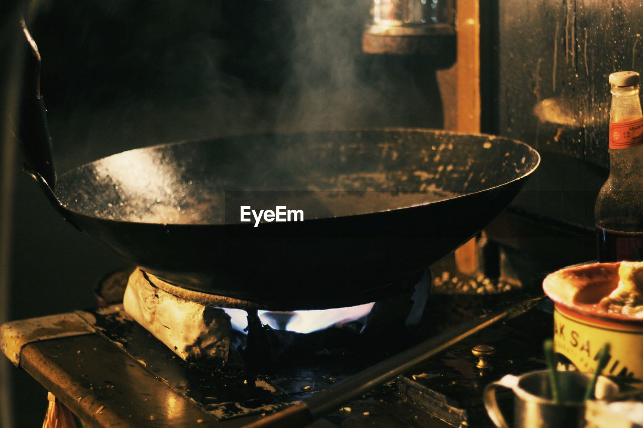 Close-up of wok on stove