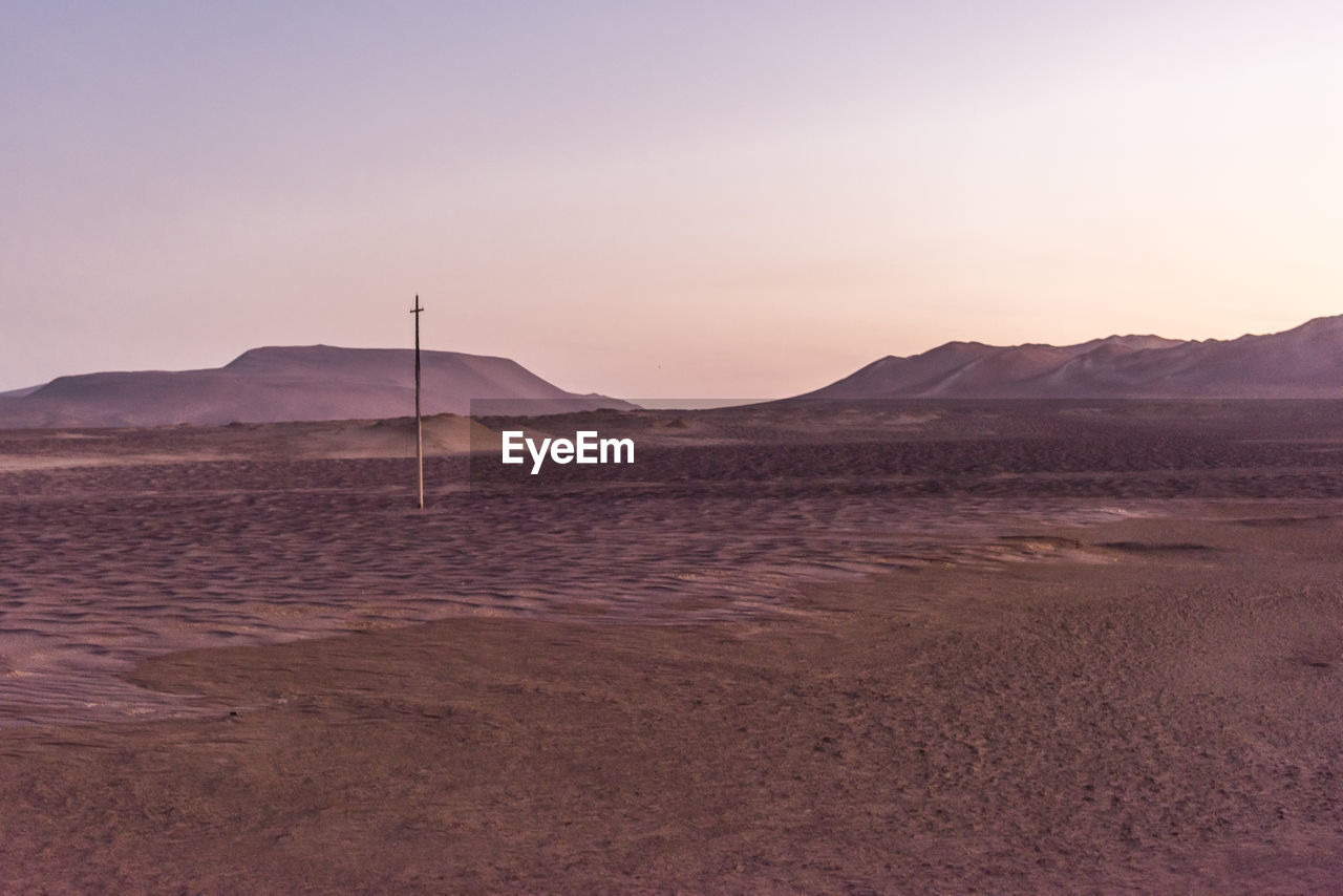SCENIC VIEW OF DESERT DURING SUNSET