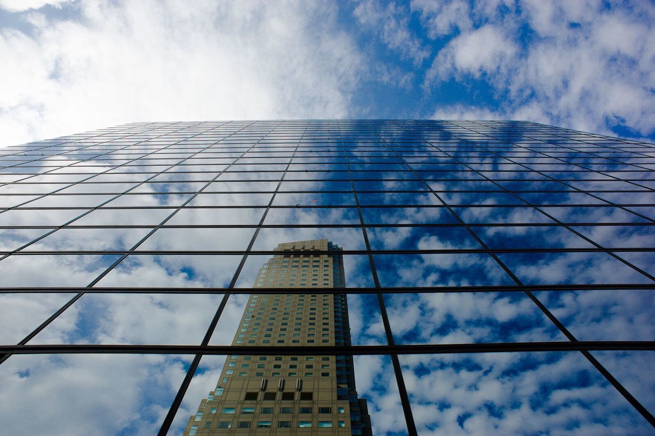 LOW ANGLE VIEW OF MODERN OFFICE BUILDING AGAINST SKY