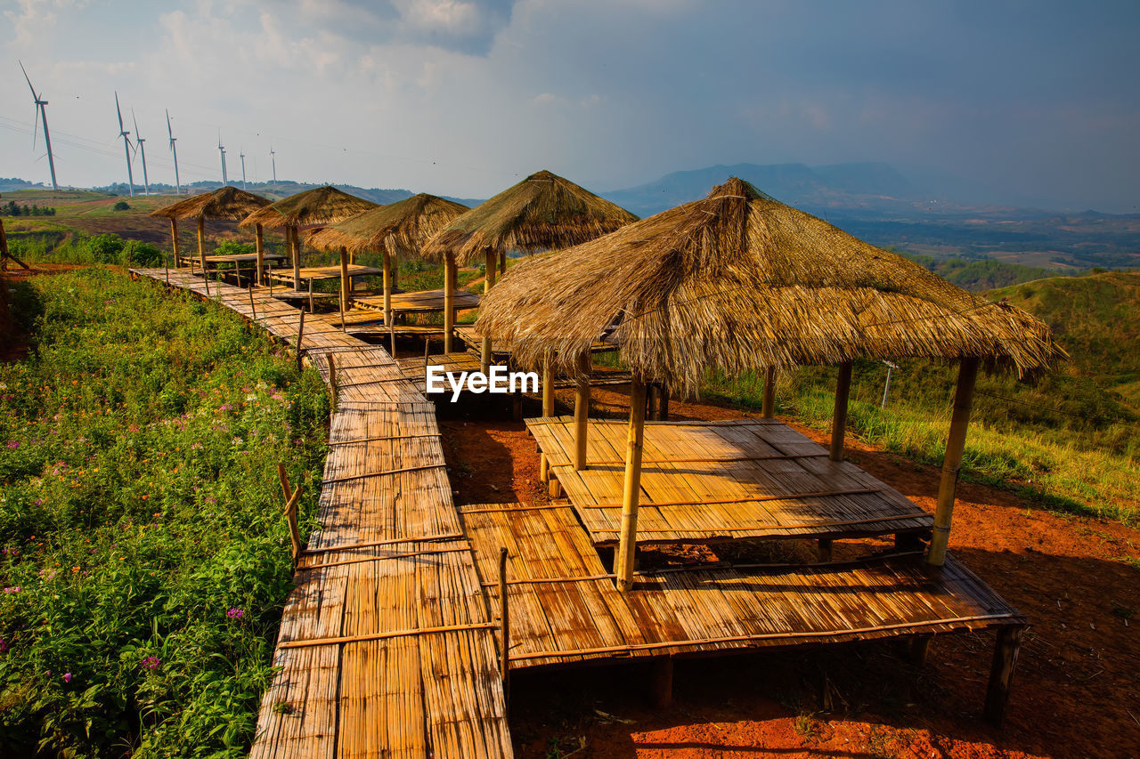 Bamboo bridges and wooden pavilion and windmills for generating electricity.