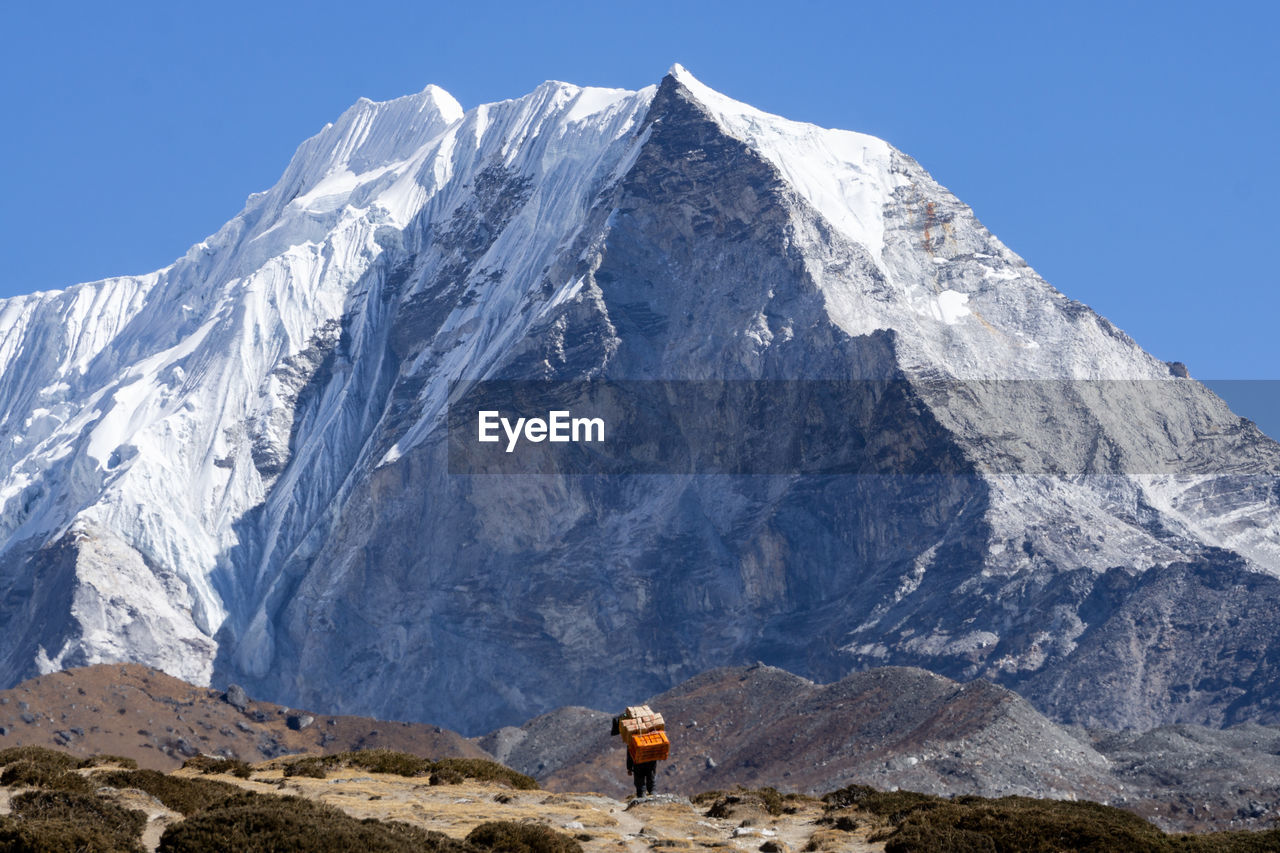 Scenic view of snowcapped mountain against sky, porter, nepal, himalaya, sherpa
