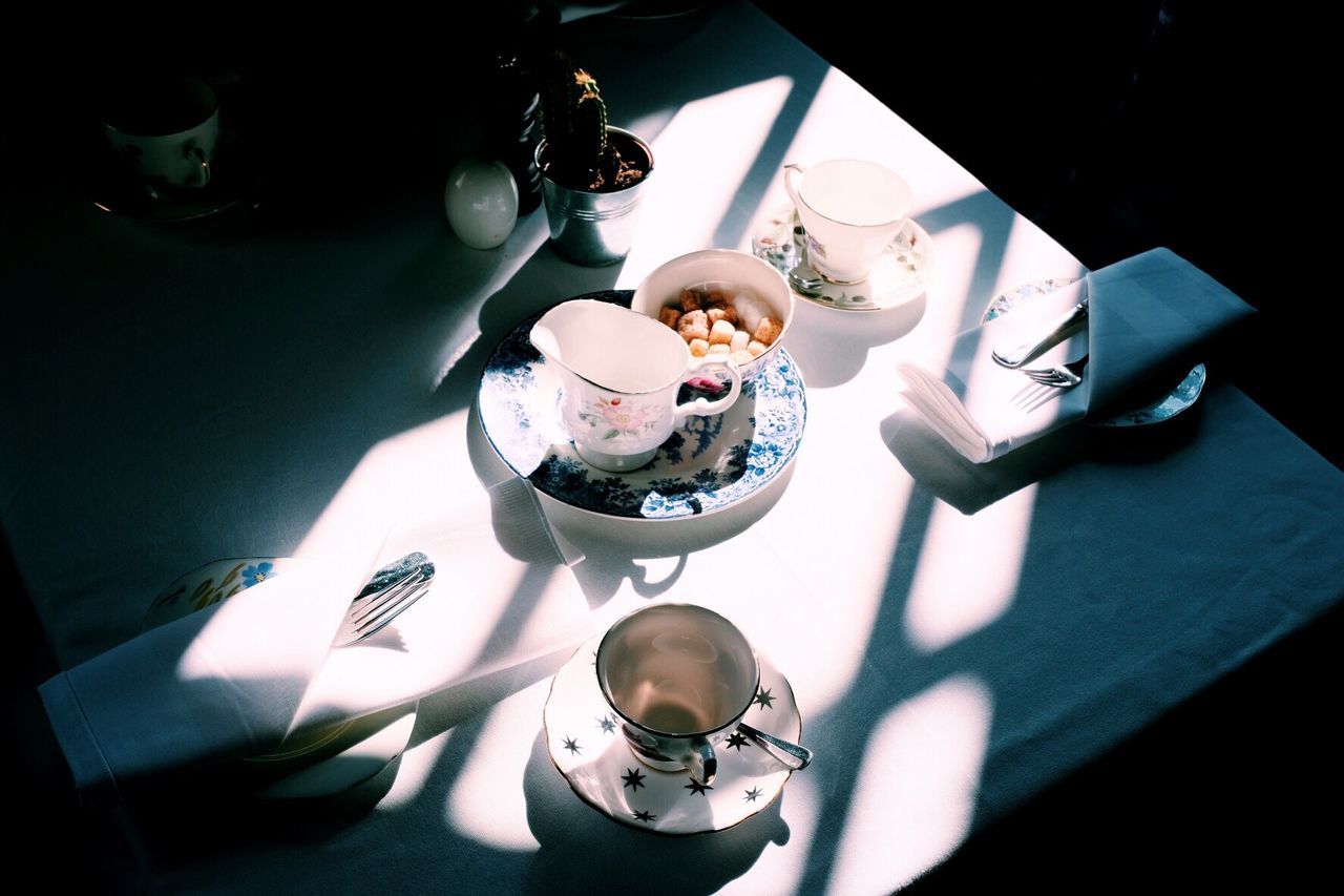High angle view of cups on table