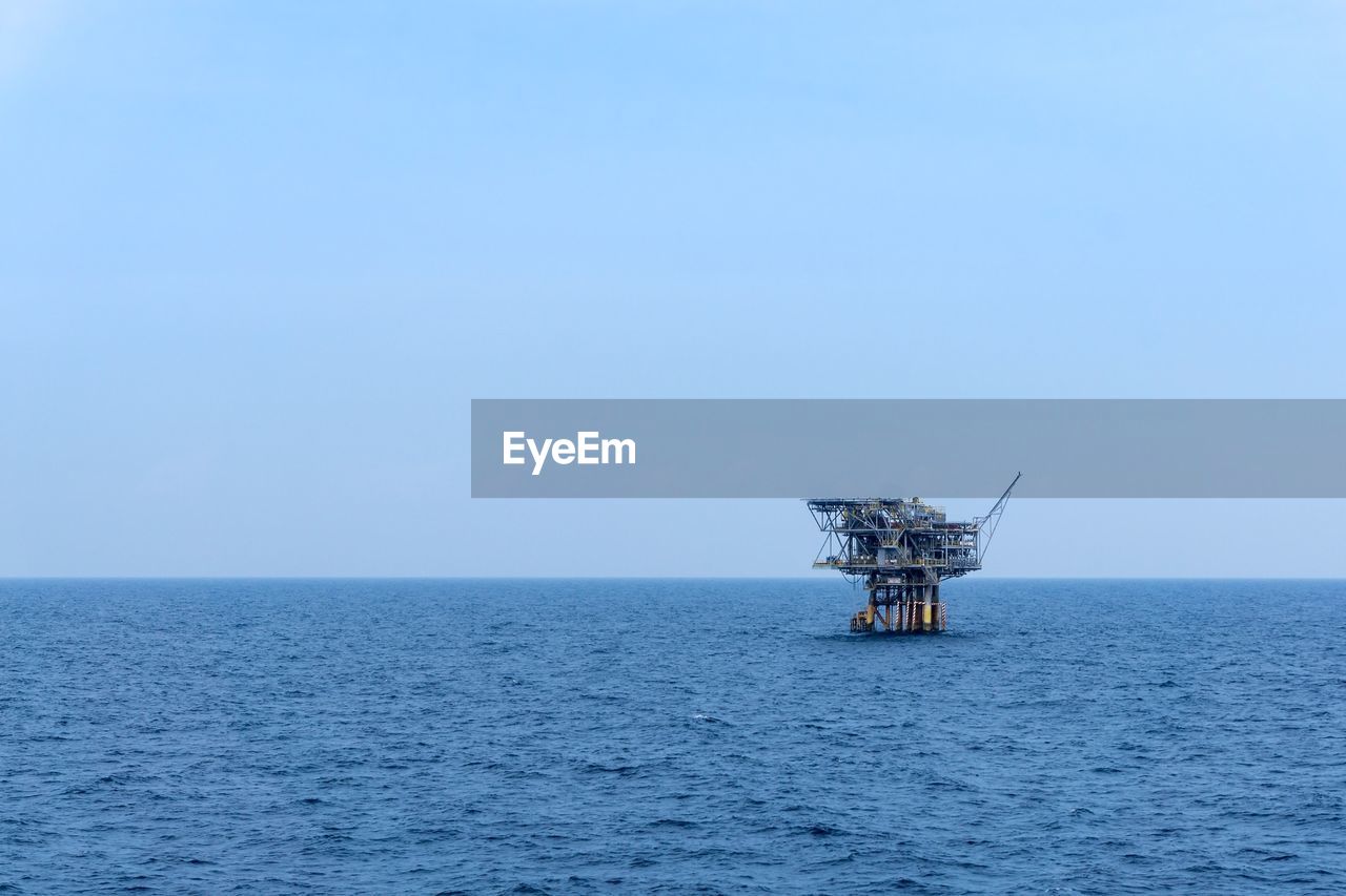 An isolated tripod satellite oil production platform at offshore terengganu oil field