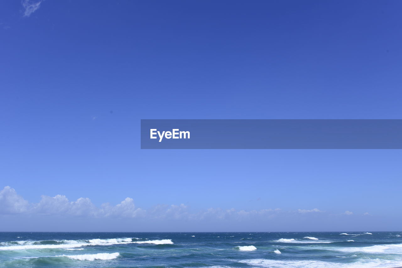 VIEW OF SEA AGAINST BLUE SKY