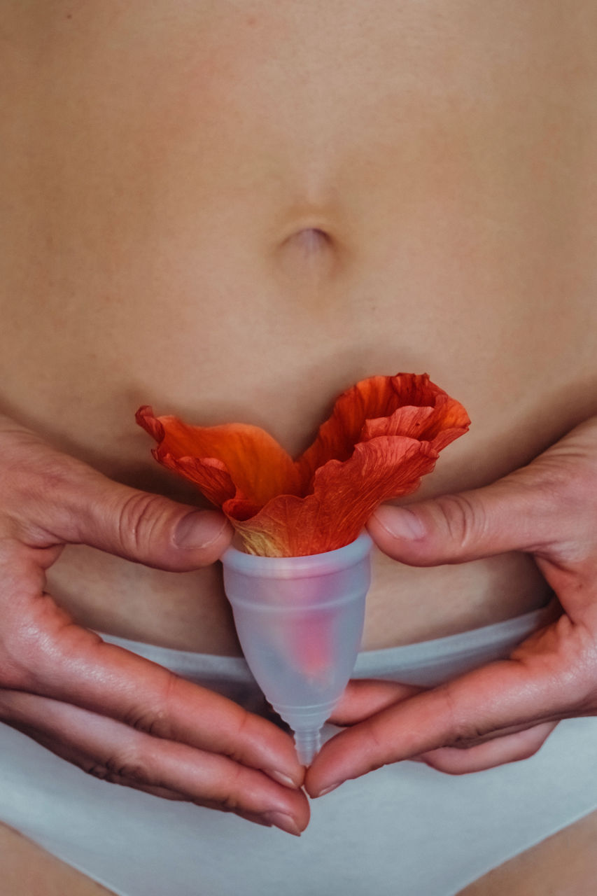Woman holding menstrual cup. gynecology and intimate hygiene concept.