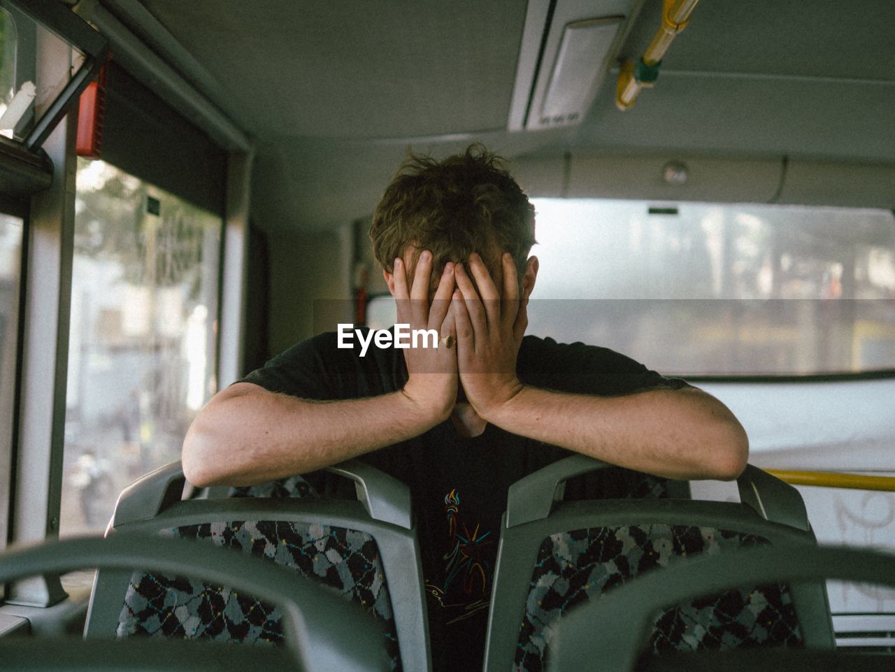 Depressed man in bus