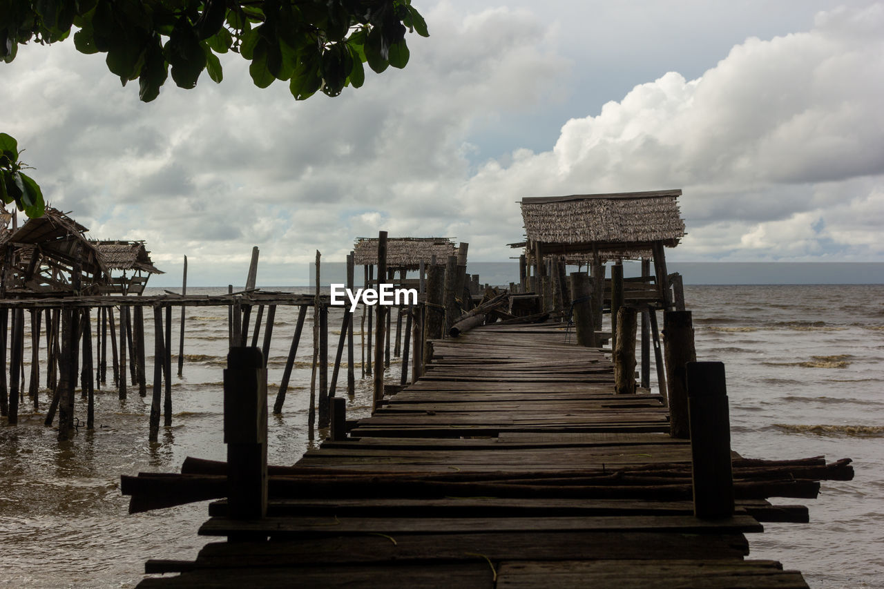 Pier over sea against sky