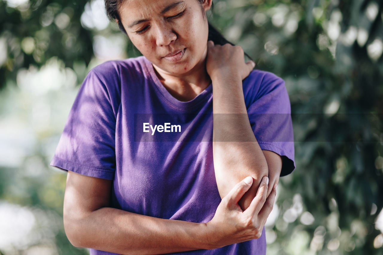 Woman suffering from elbow pain