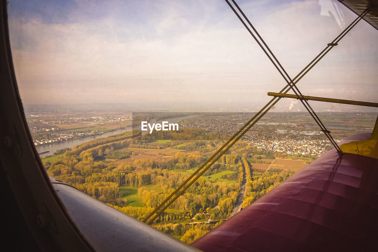 Aerial view of cityscape seen through window