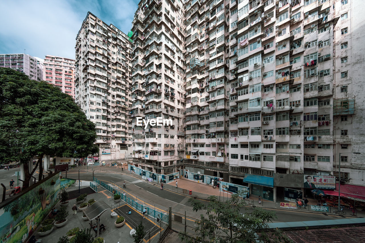 High angle view of street amidst buildings in city, quarrybay, hong kong. 
