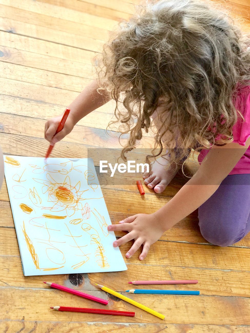 High Angle View Of Girl Drawing While Id 109593249