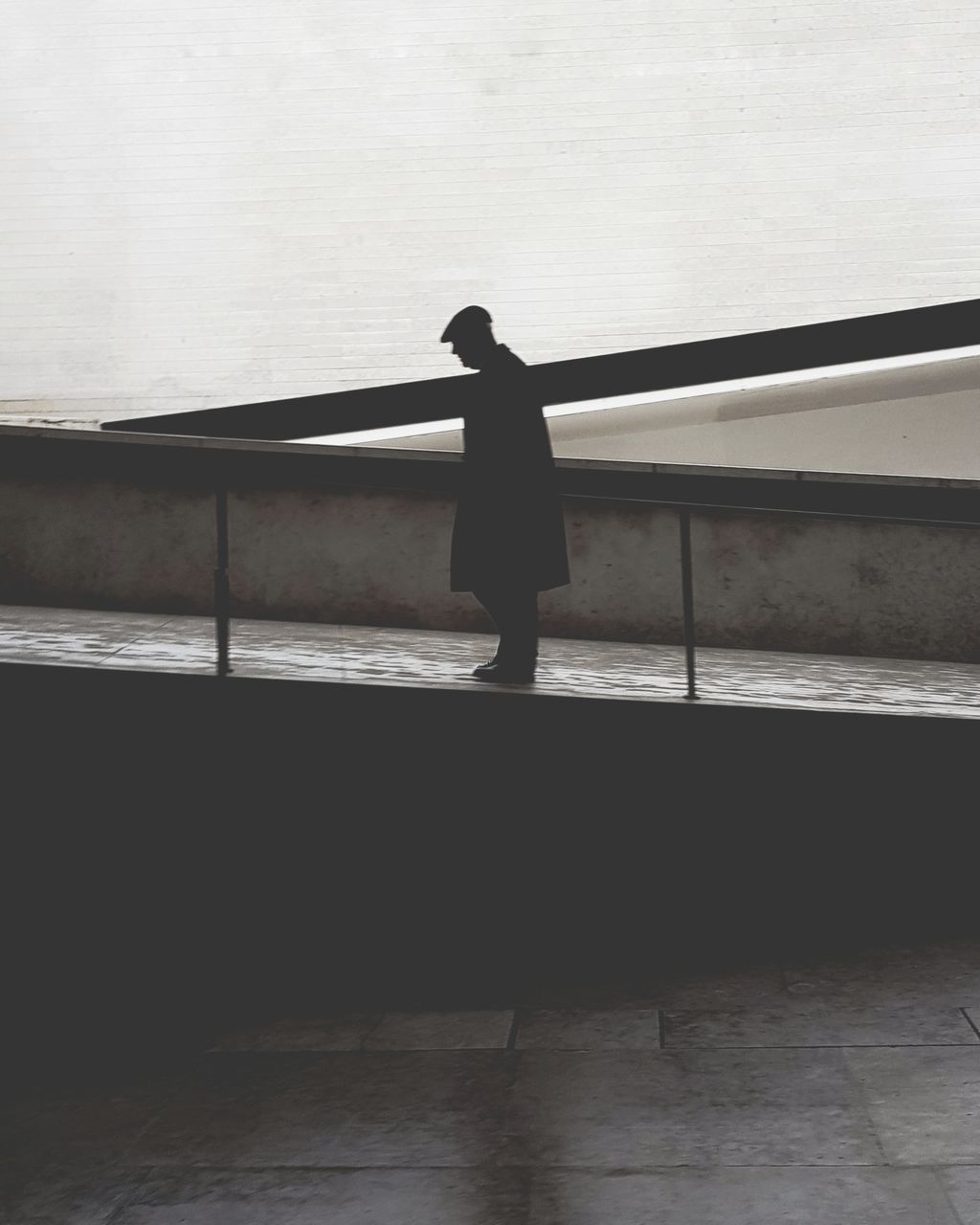 SIDE VIEW OF SILHOUETTE WOMAN STANDING BY RAILING