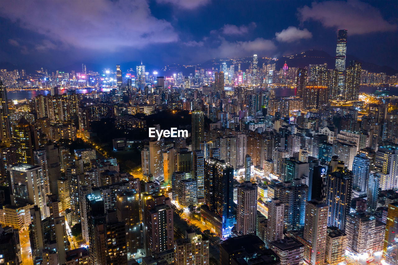 Aerial view of modern buildings in city at night