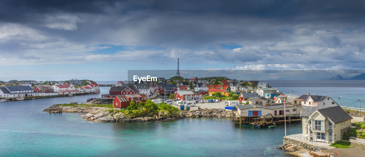 BUILDINGS BY SEA AGAINST SKY