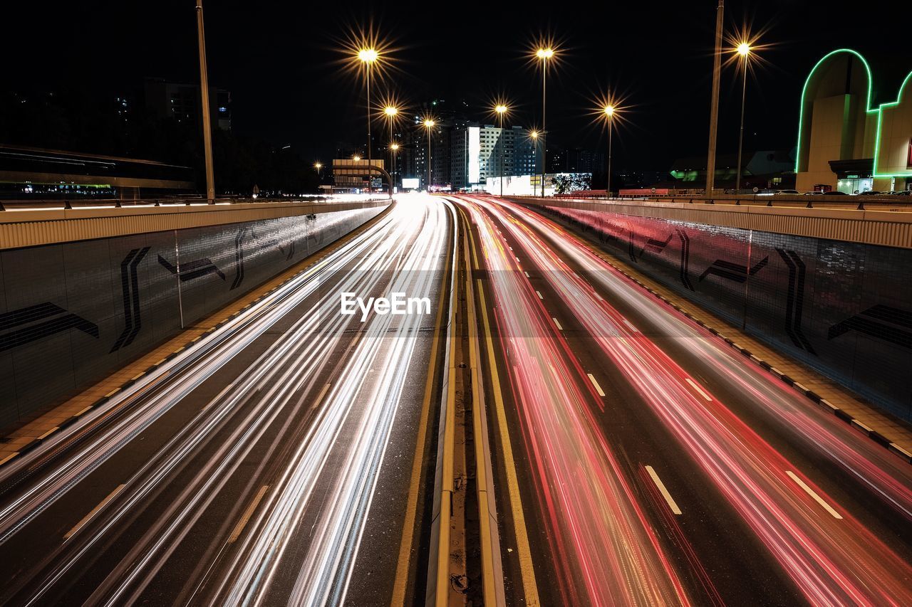 Light trails on street in city at night