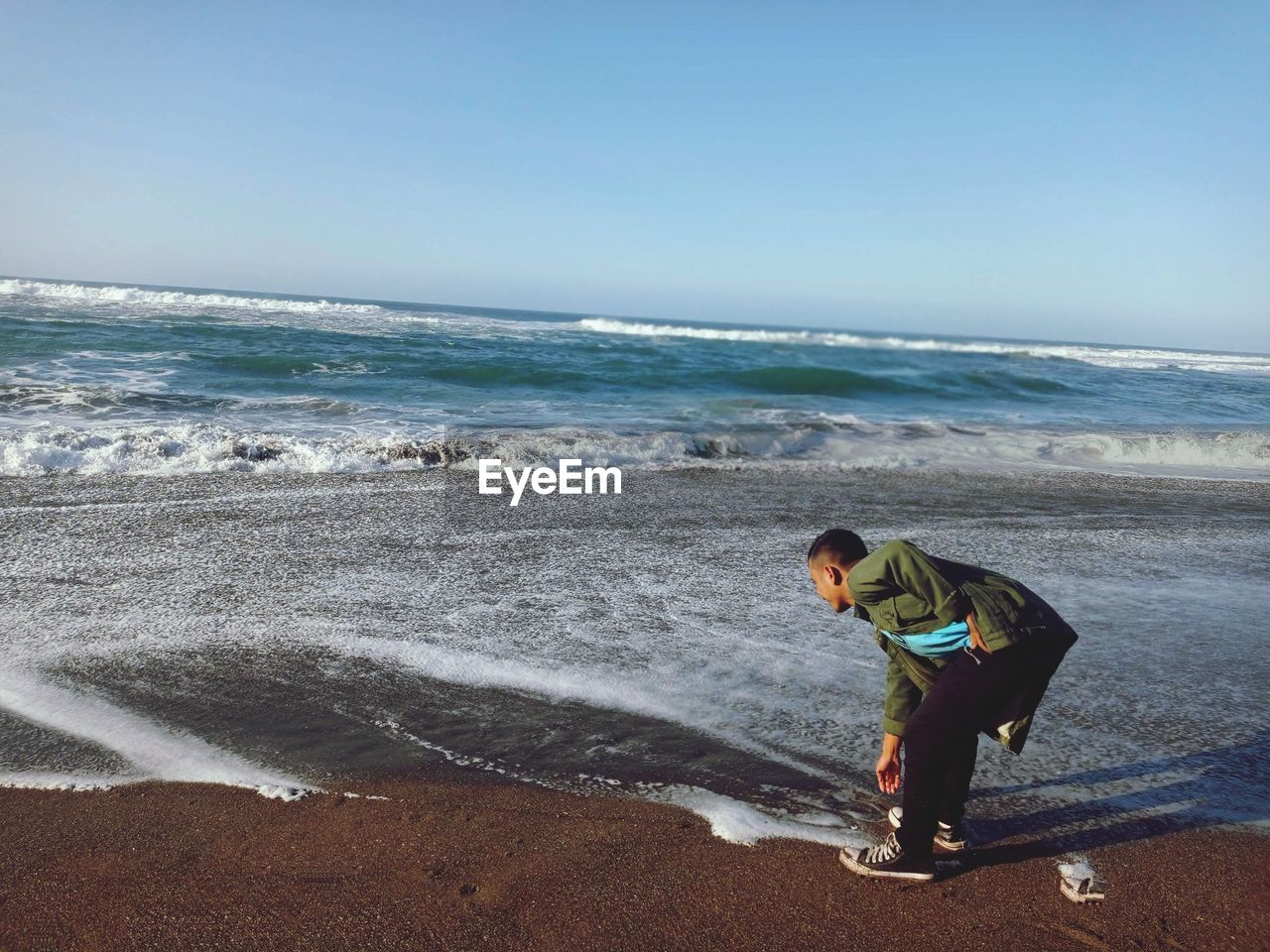 Man looking at sea against sky