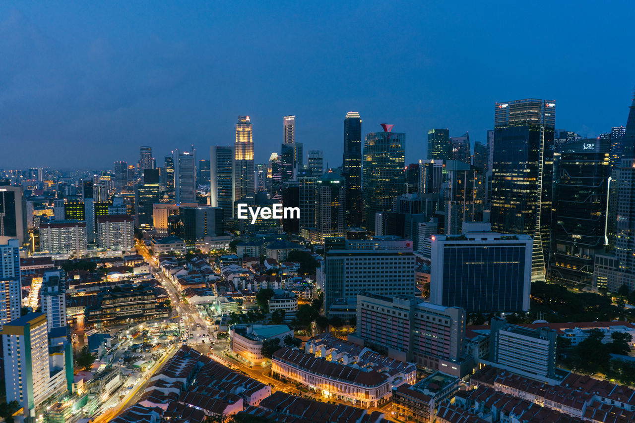 High angle view of illuminated buildings in city against sky