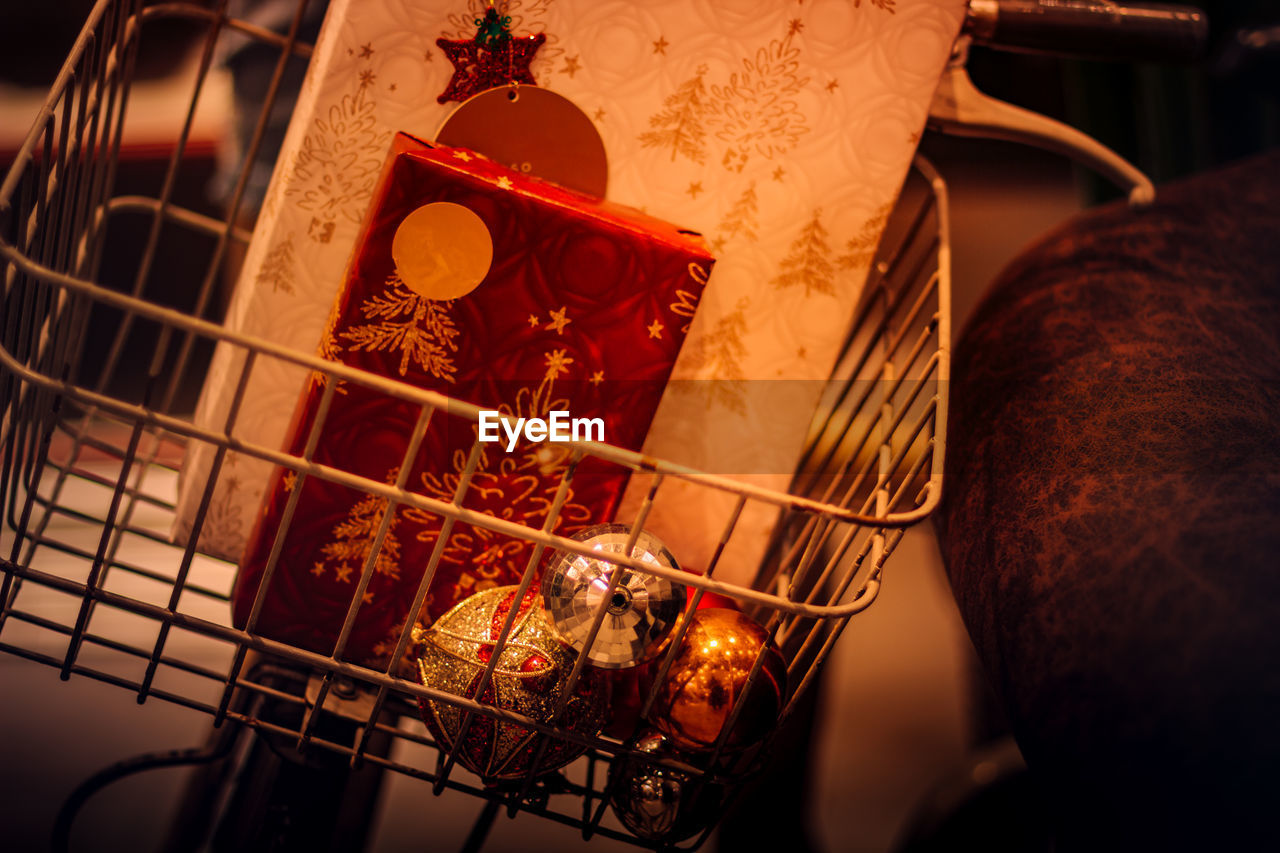 High angle view of gifts and decoration in bicycle basket