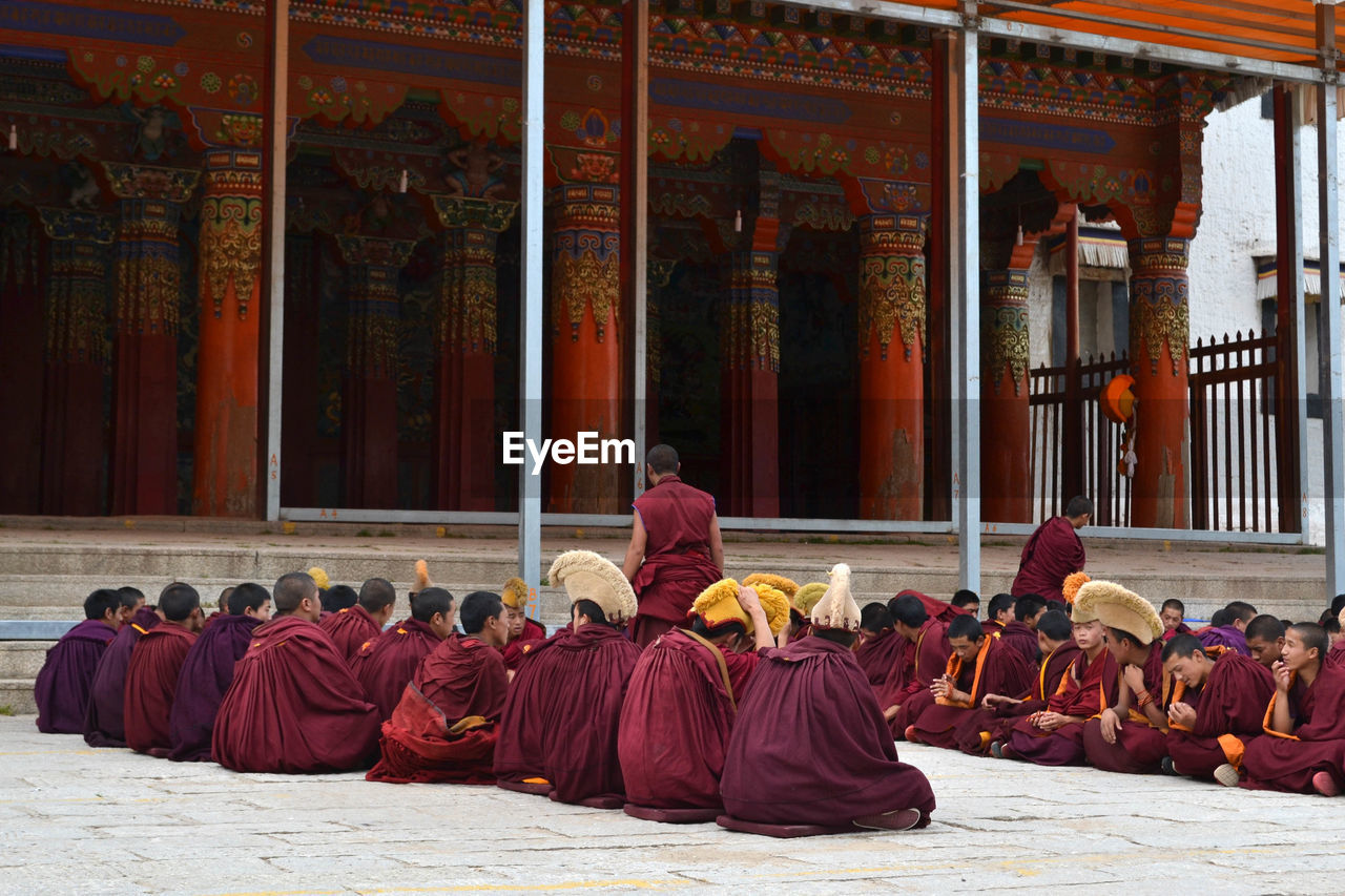 Group of monks outside temple