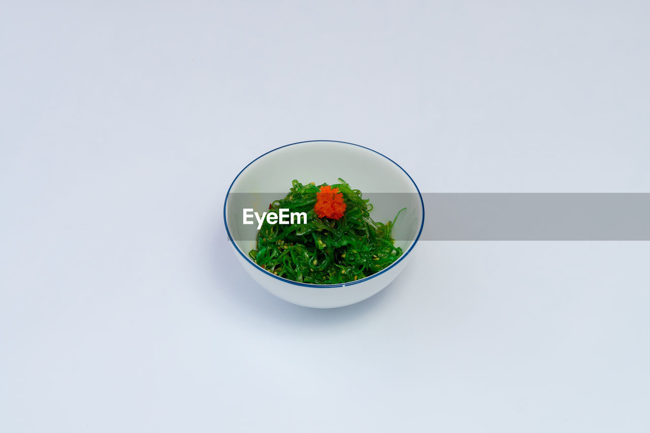 high angle view of food in bowl on white background