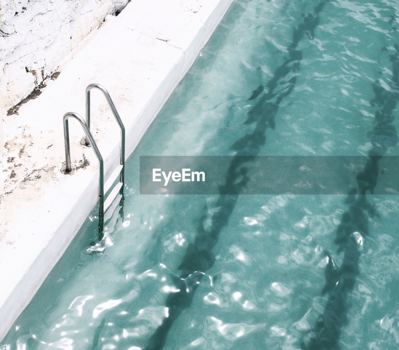 High angle view of railing in swimming pool