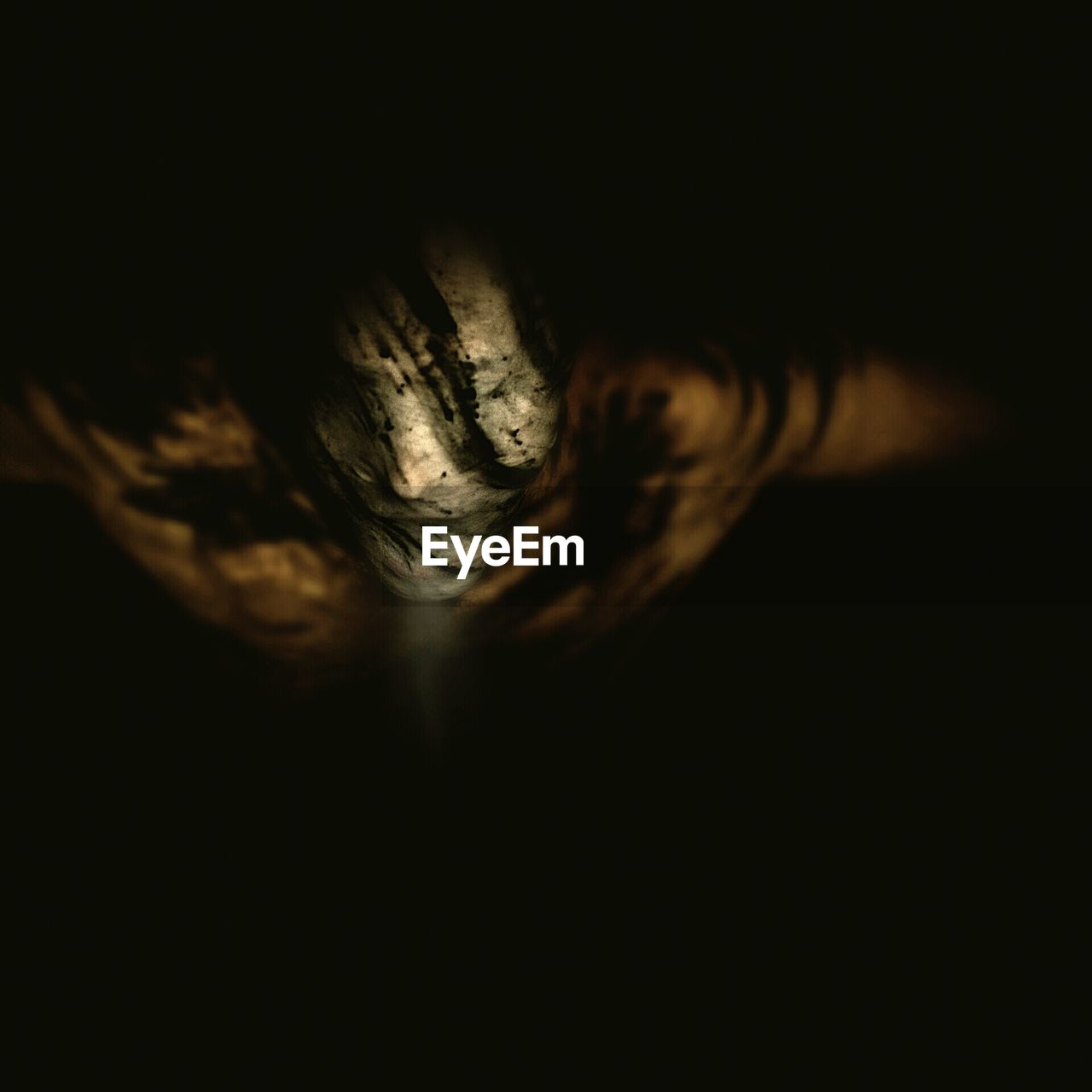 CLOSE UP VIEW OF HUMAN EYE OVER BLACK BACKGROUND
