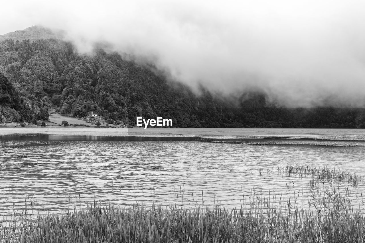 SCENIC VIEW OF LAKE DURING FOGGY WEATHER