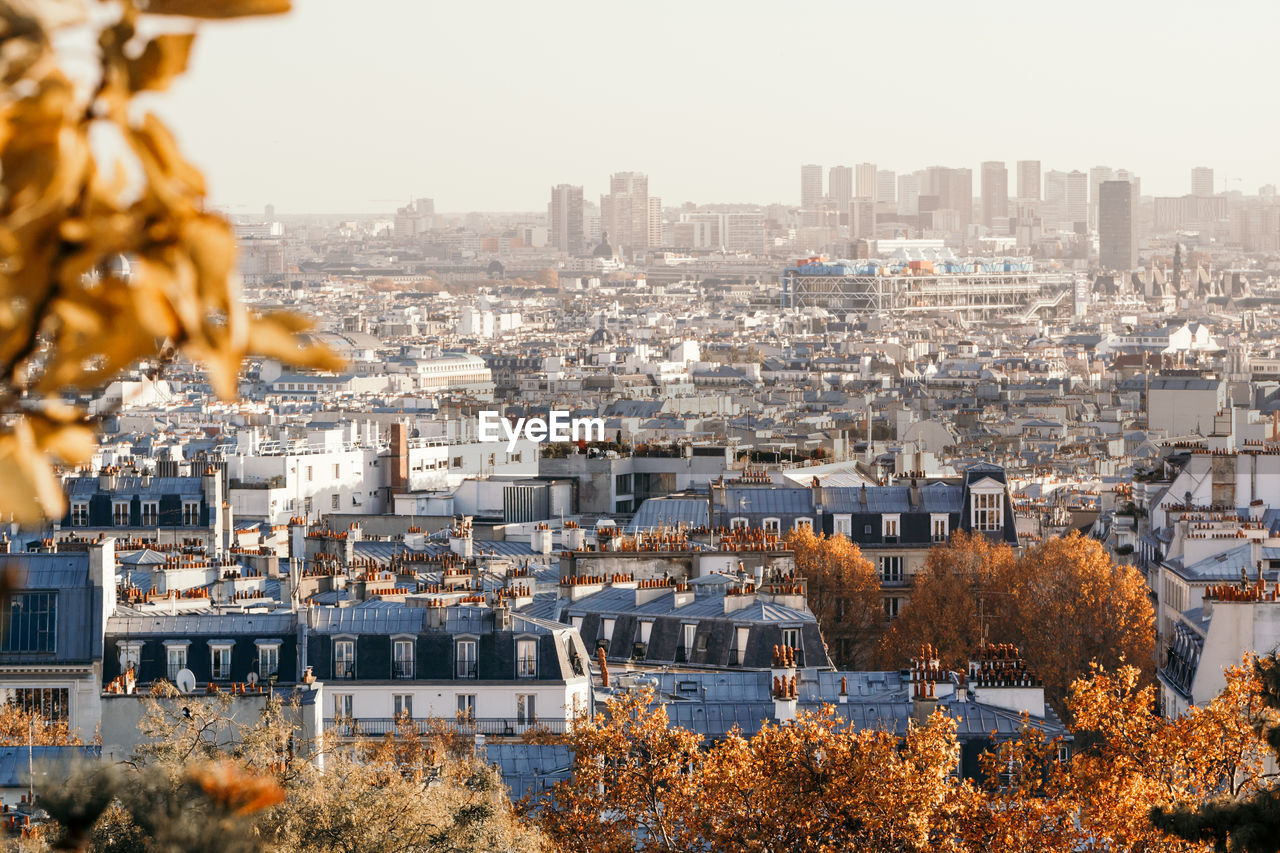 High angle view of buildings in city against sky