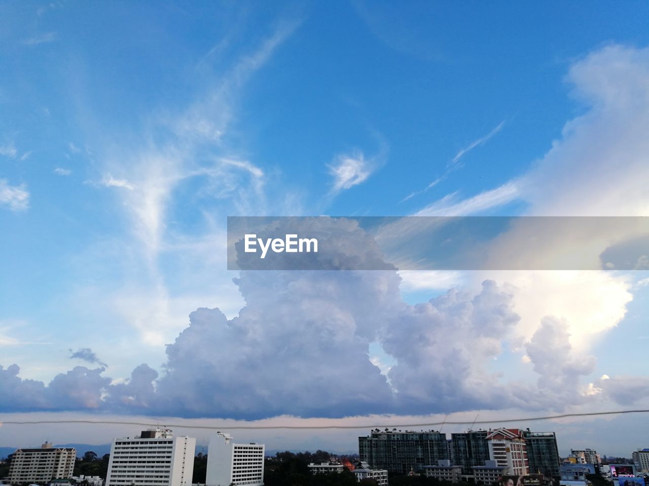 PANORAMIC VIEW OF RESIDENTIAL BUILDINGS AGAINST SKY
