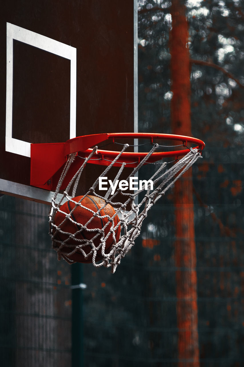 Close-up of basketball in hoop