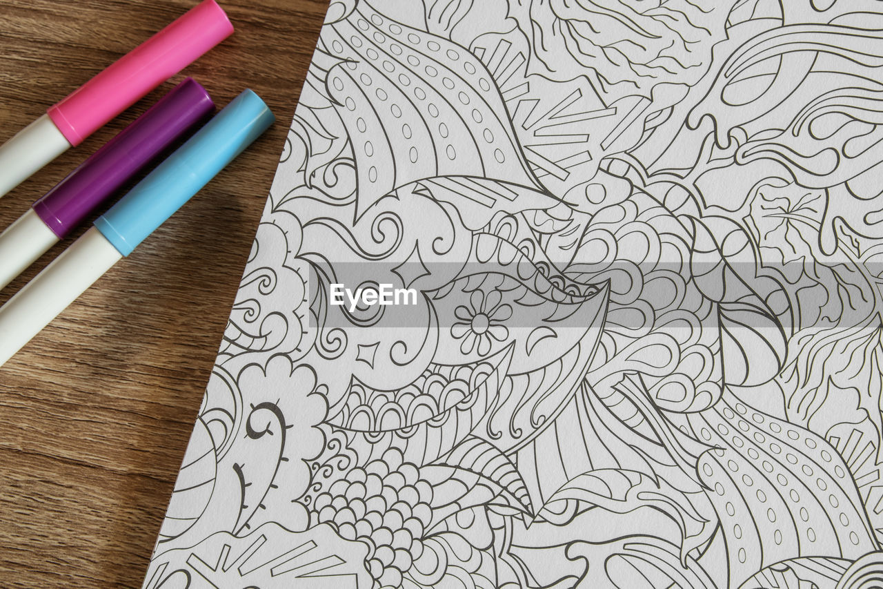 Coloring book with markers, creative drawings