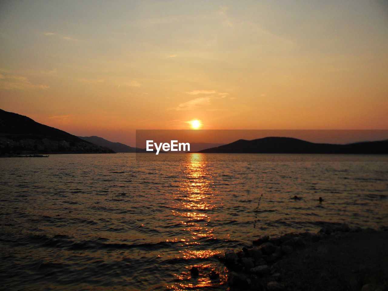 Scenic view of sea at sunset