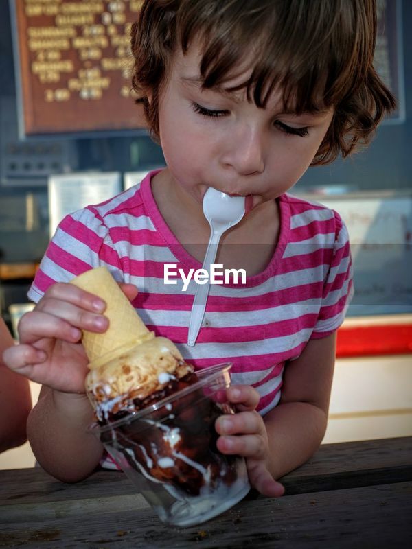 Close Up Of Girl Holding Icecream Cone Id