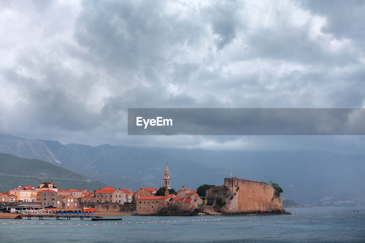 Budva old town in the stormy weather . clouds over the adriatic sea in montenegro