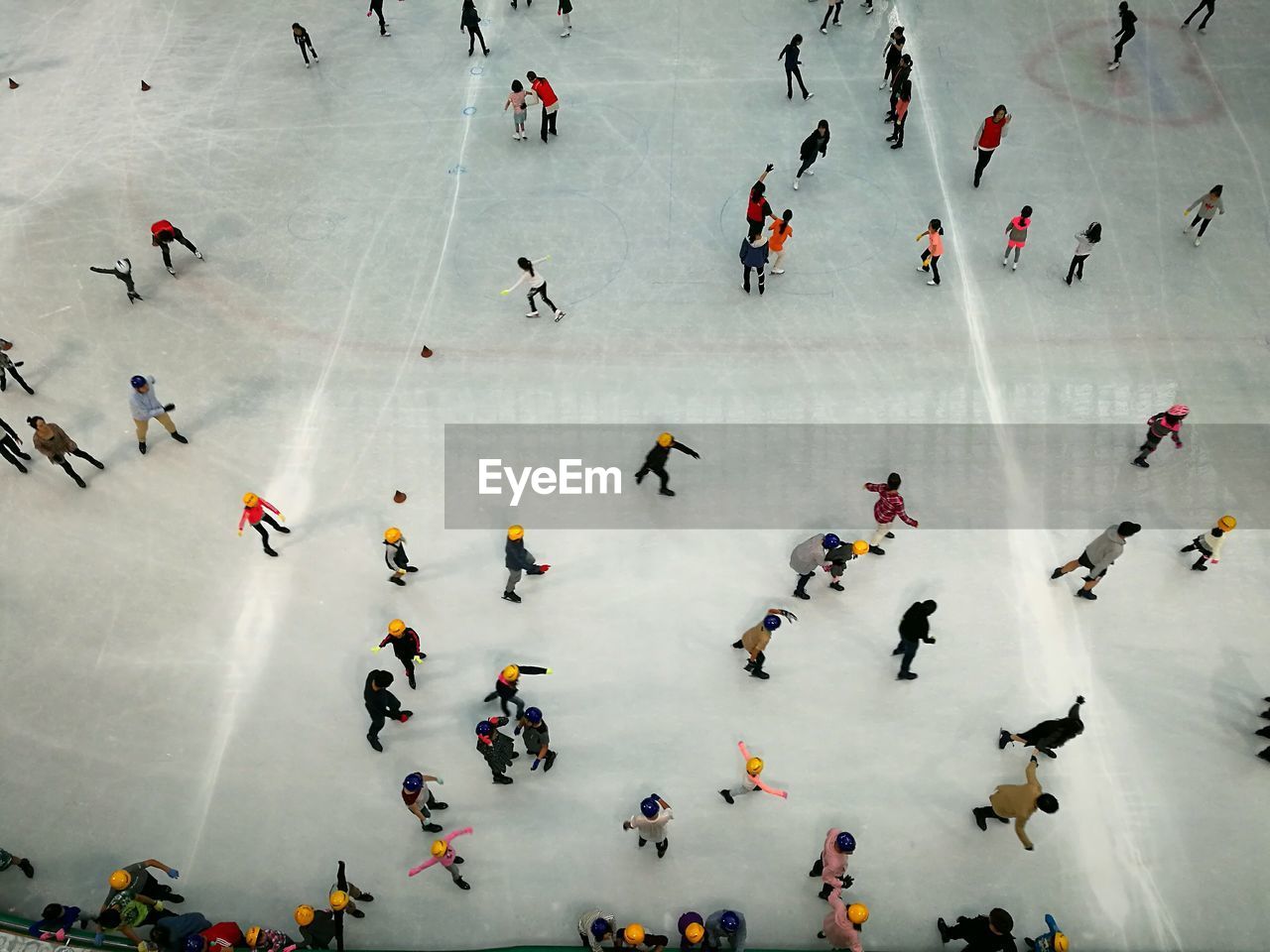 High angle view of people doing ice skate on snow