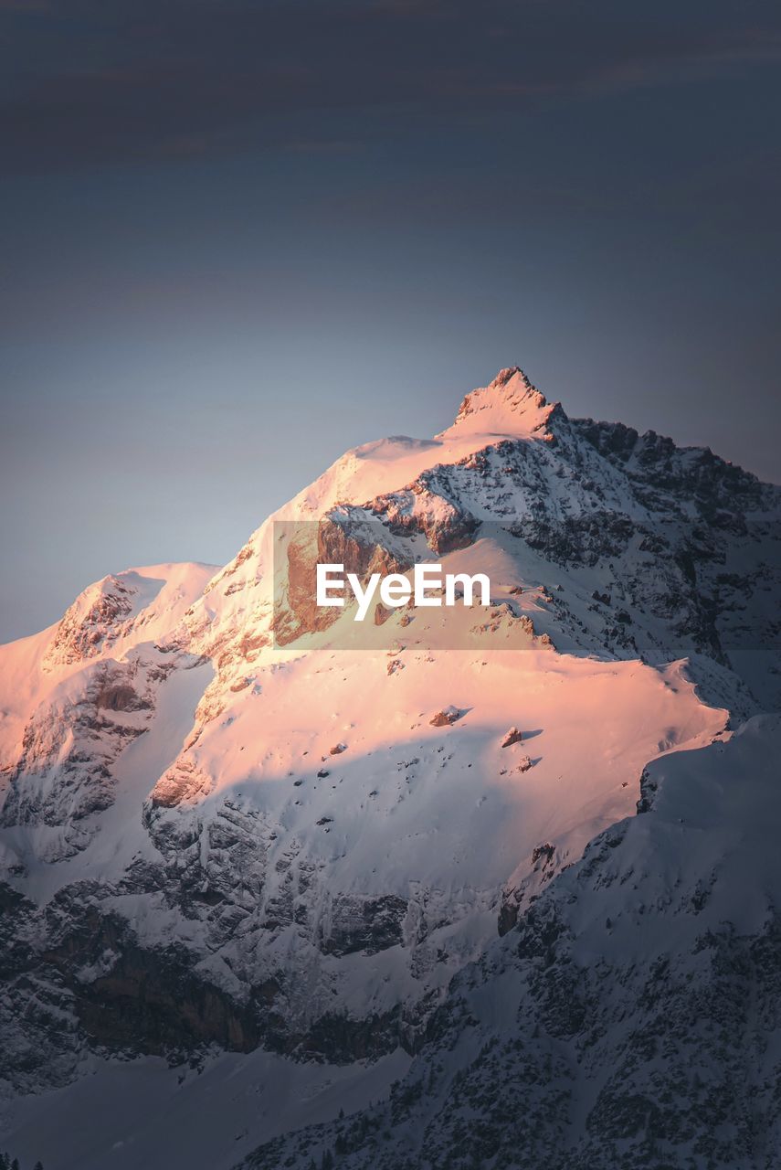Scenic view of snowcapped mountains against sky during winter