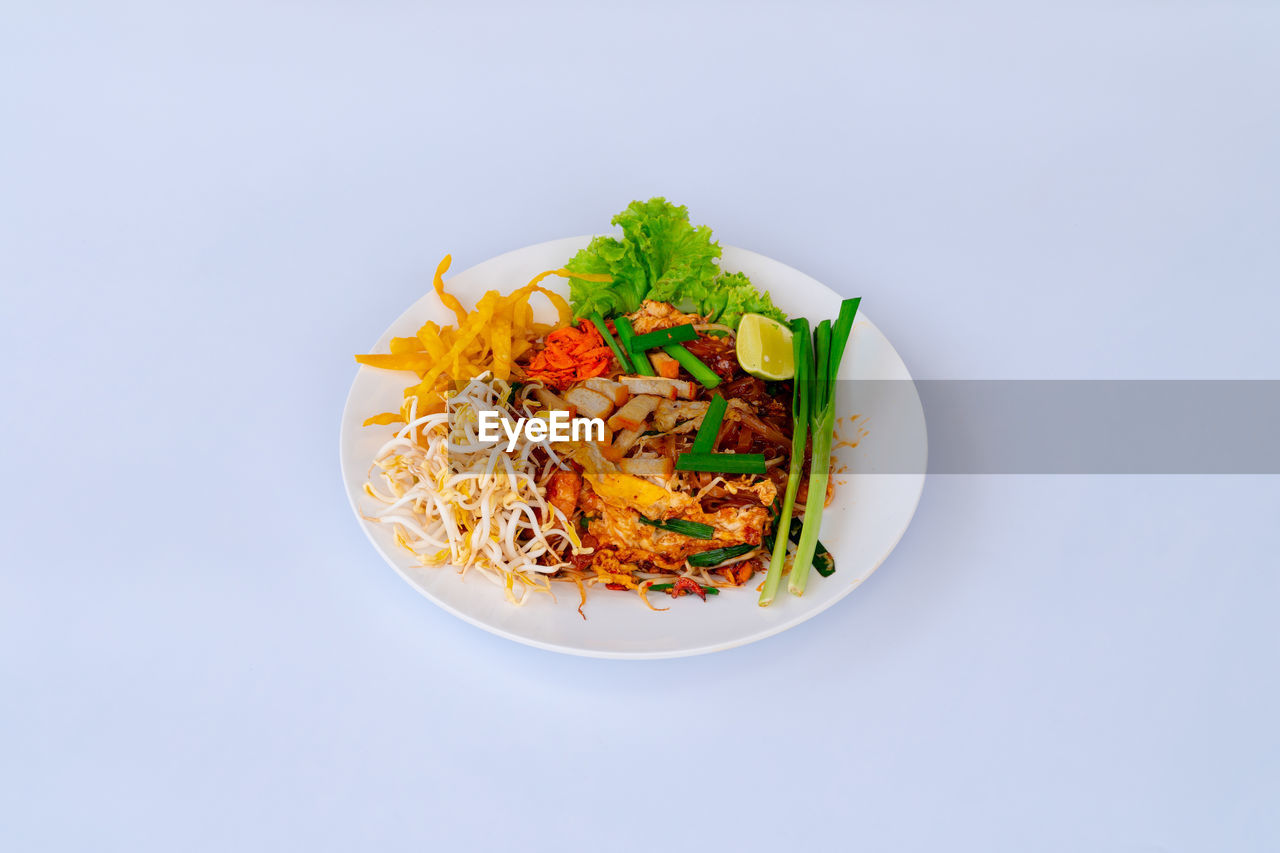 directly above shot of food in bowl on white background