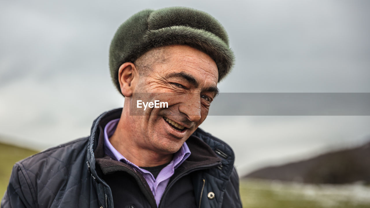 Smiling azerbaijani man with a hat