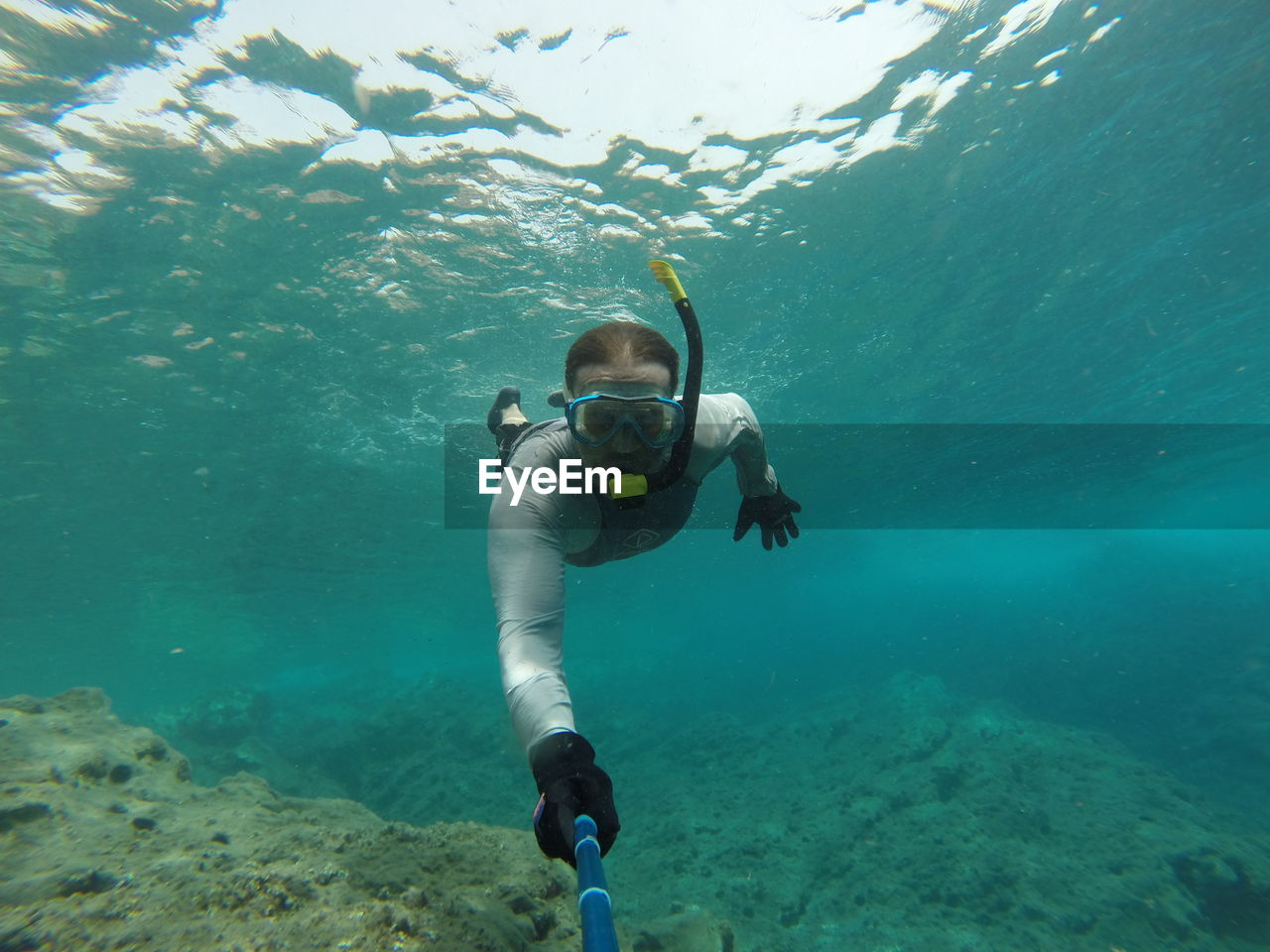 Portrait of man swimming undersea