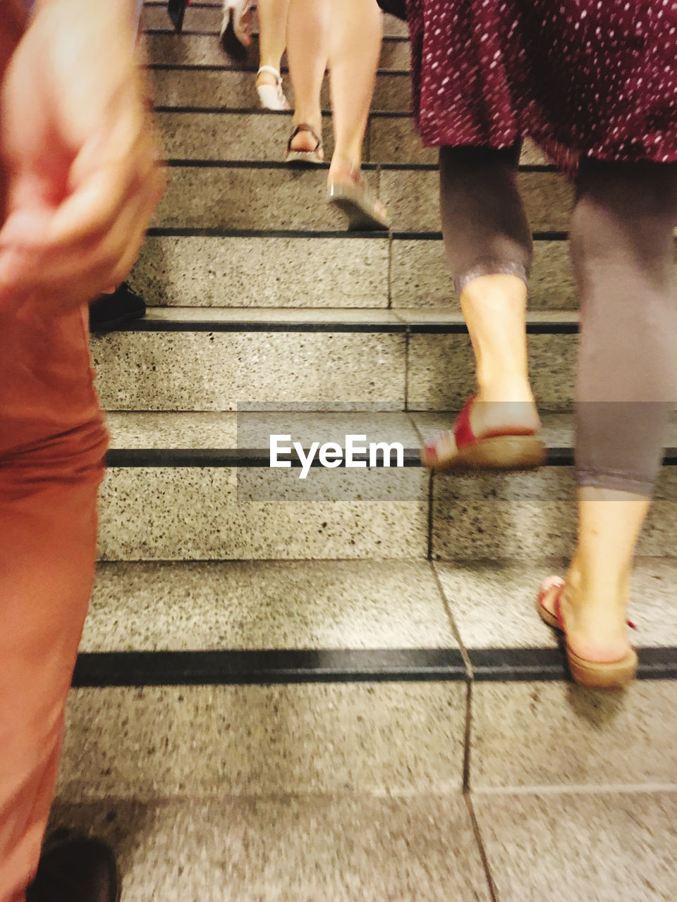 LOW SECTION OF WOMEN WALKING ON STEPS