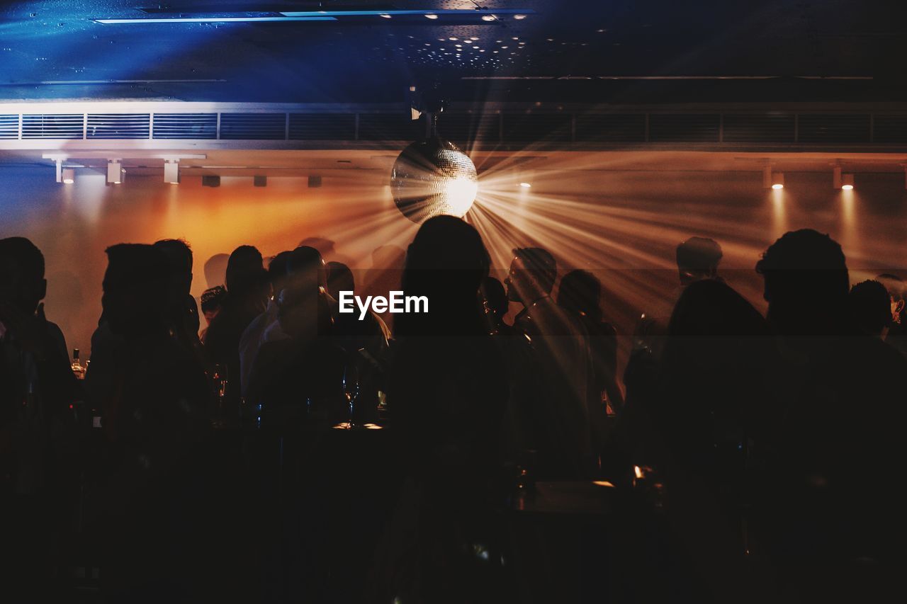 Silhouette people in nightclub 