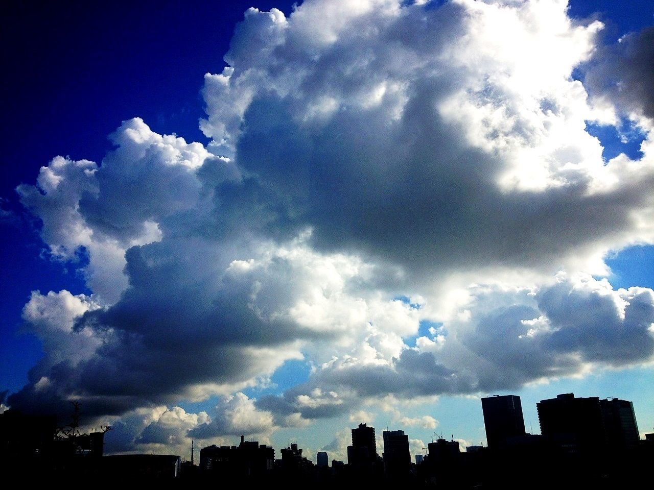Cloudscape over city