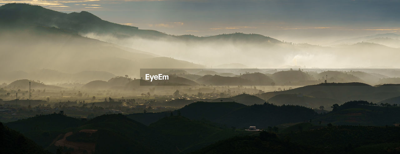 Panoramic view of mountains against sky during dawn