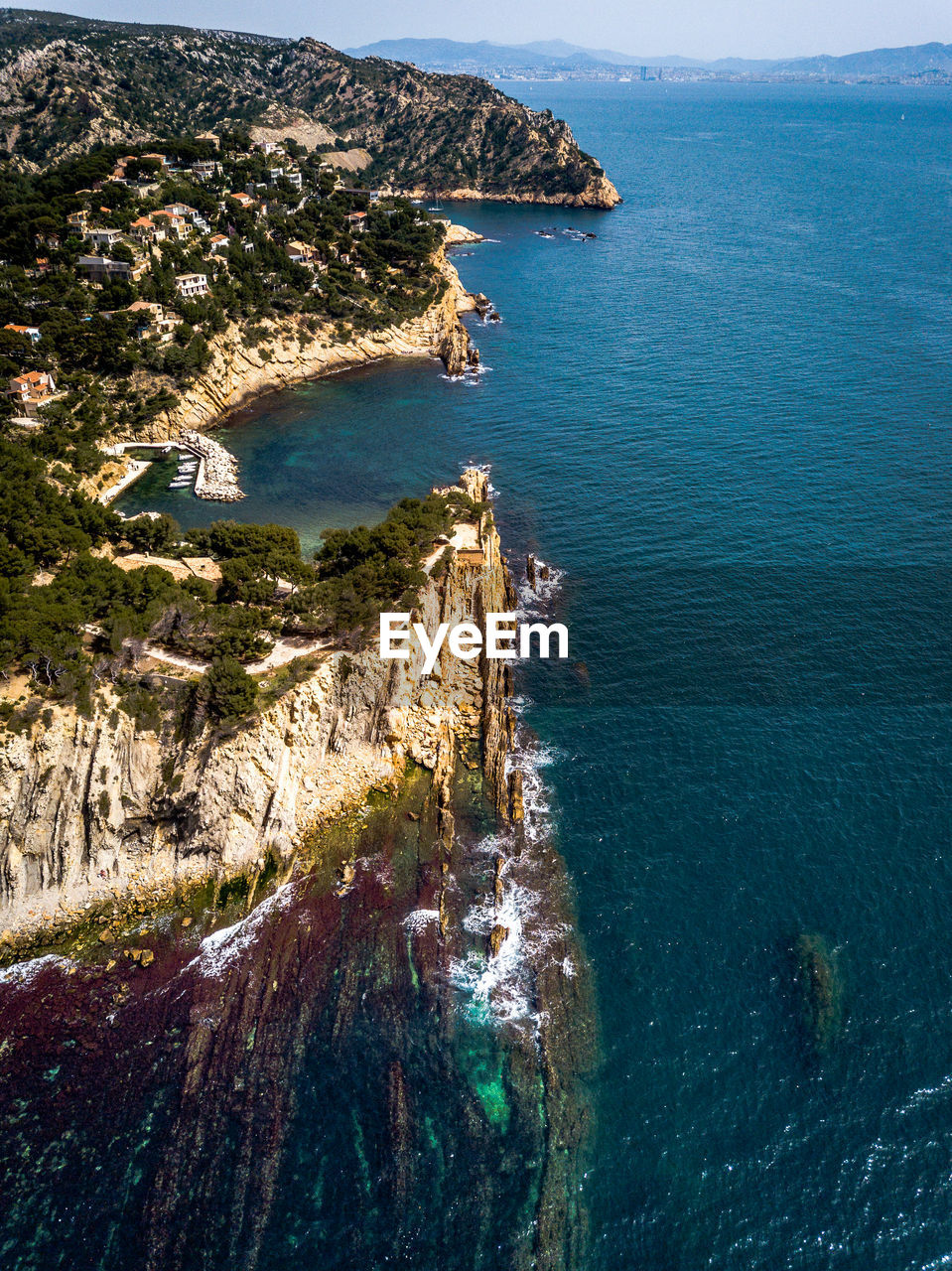 Aerial view of cliff by sea